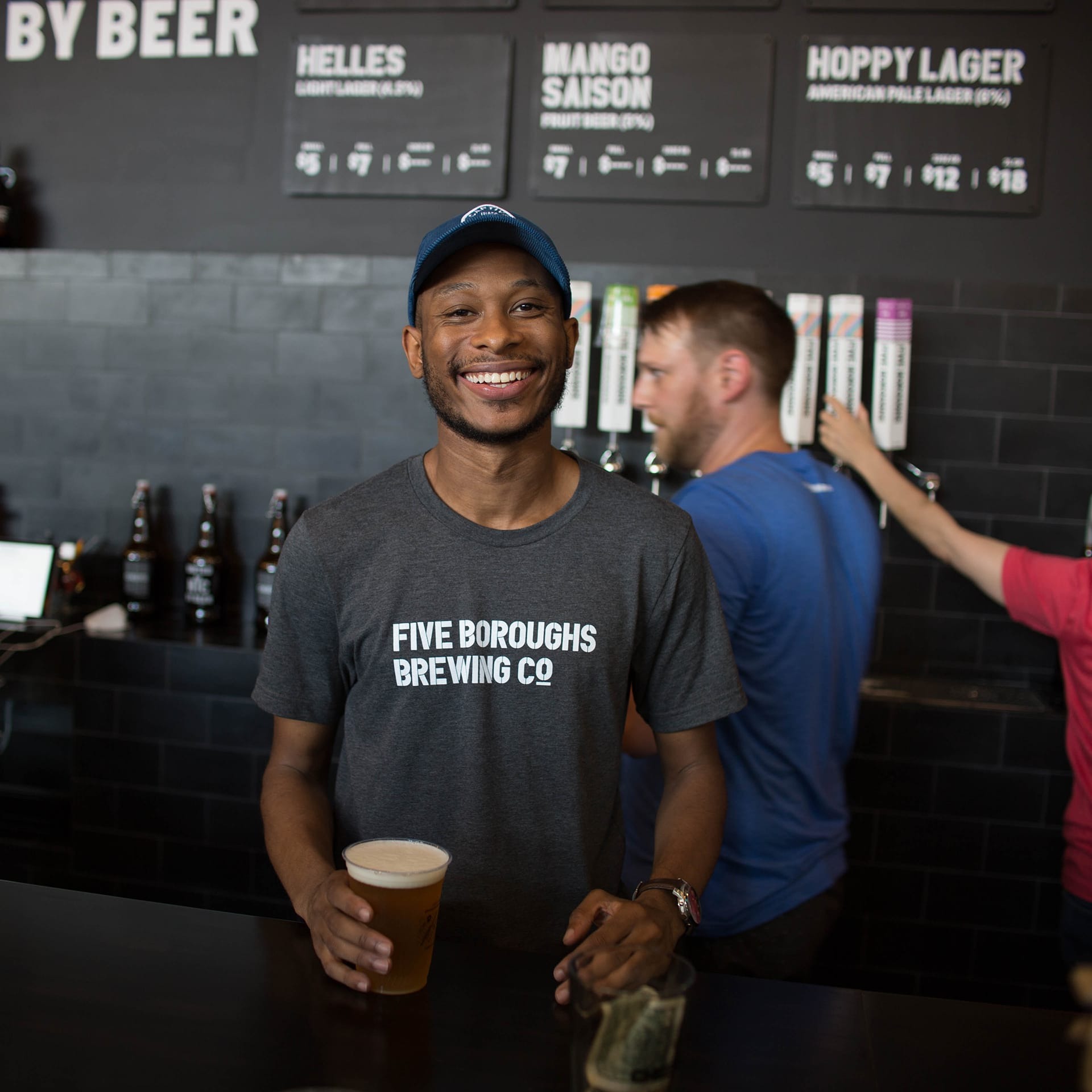 bartender serving a beer