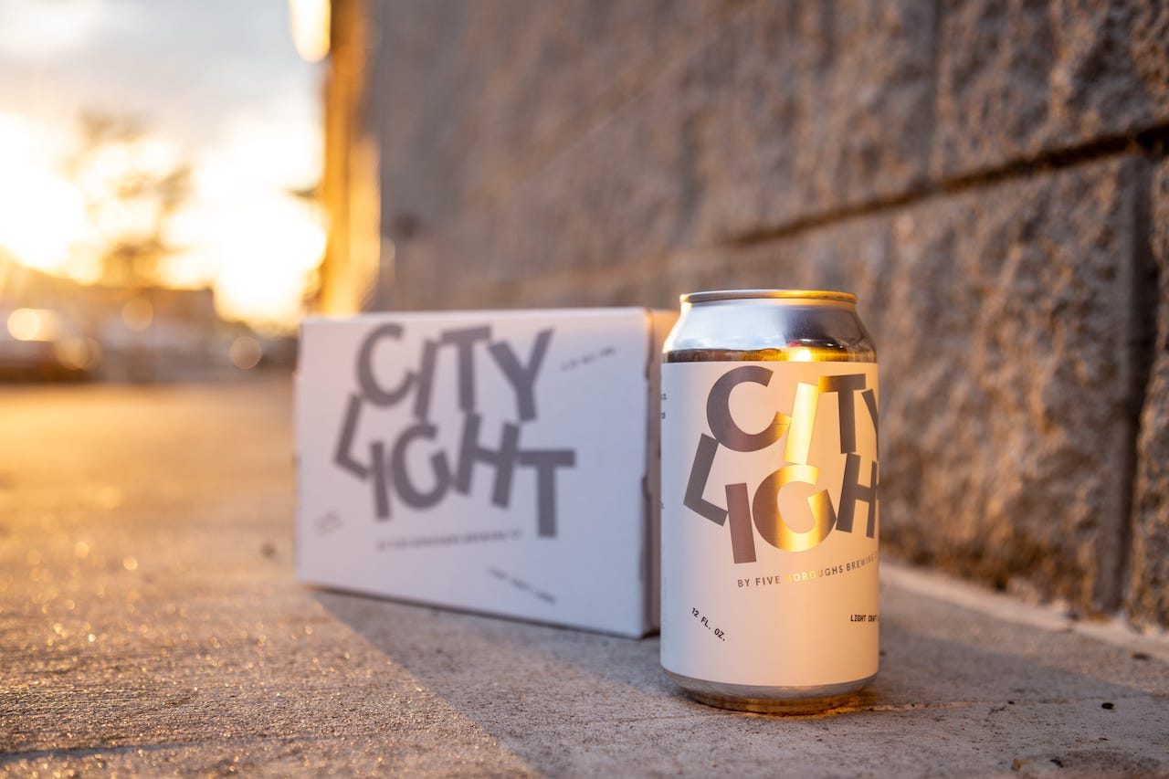 boxes of the city light beer cans