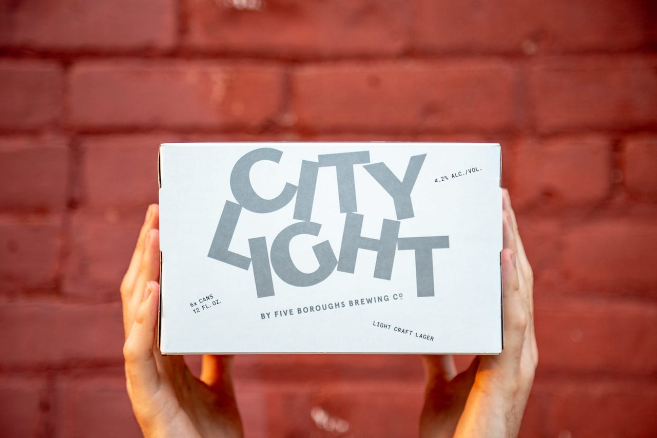 city light beer cans being packaged