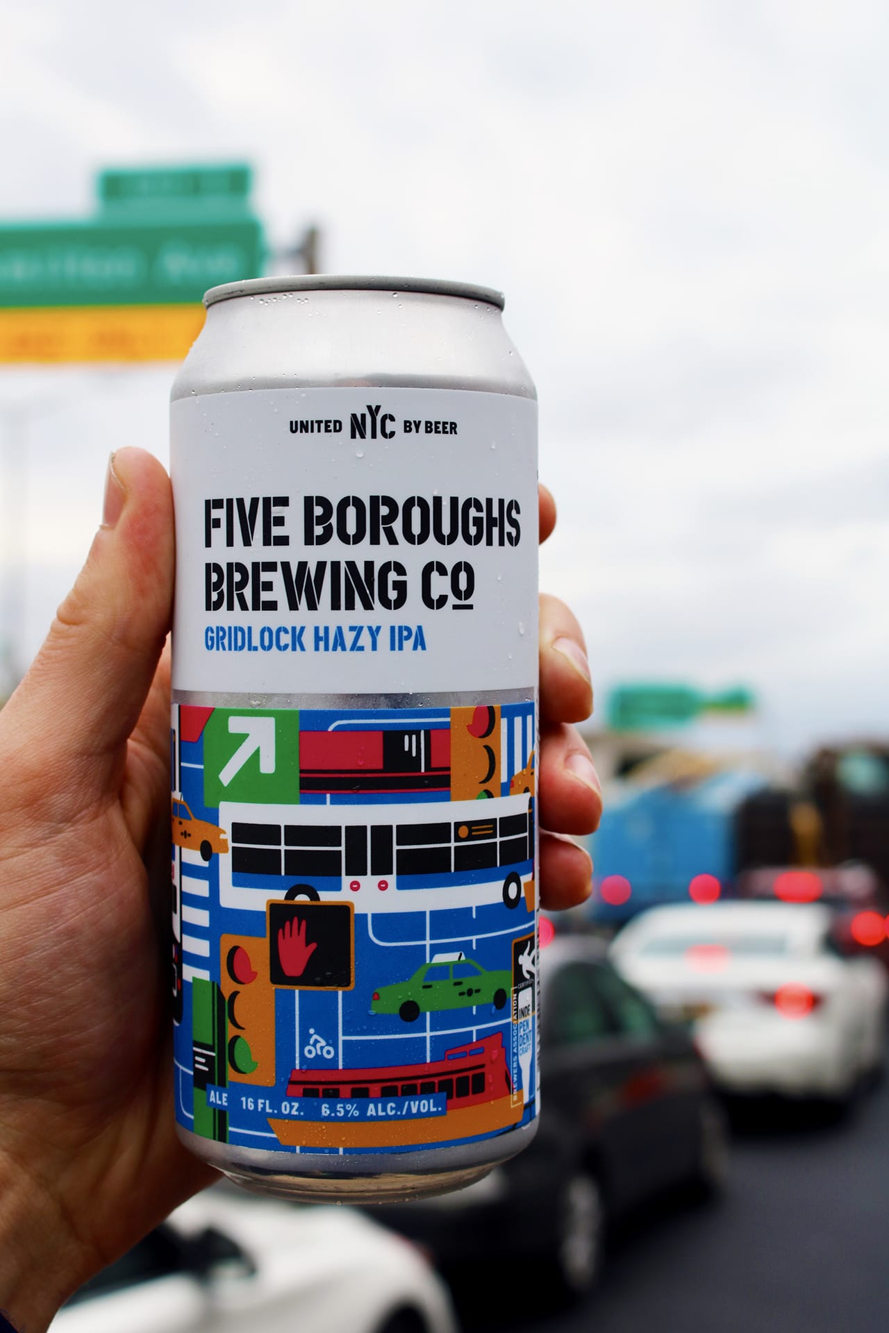 someone holding the gridlock beer can